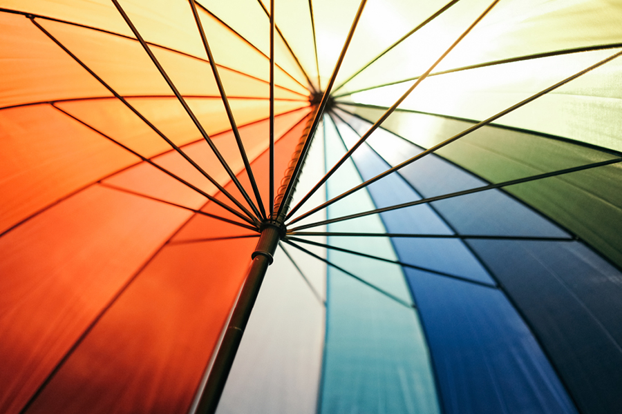 Looking under a rainbow umbrella